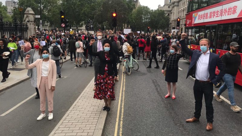 Olivia and colleagues showing solidarity to those resisting racism and police violence outside Parliament during the Black Lives Matter London peaceful protest.