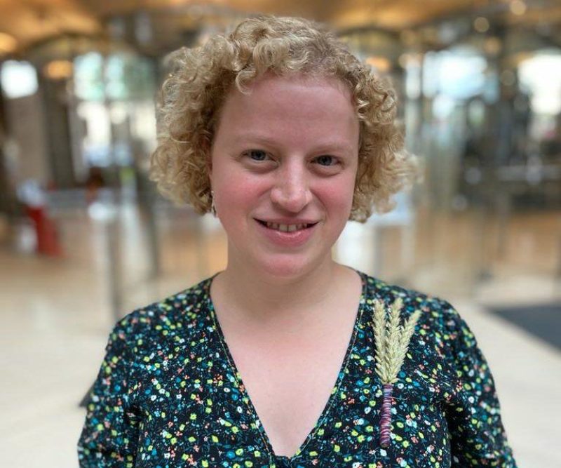 Olivia in the atrium of the House of Commons wearing a wheat sheaf pin from the NFU to celebrate Back British Farming Day.