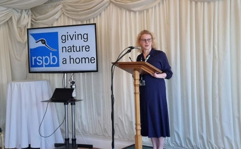 Olivia speaking at an RSPB event.
