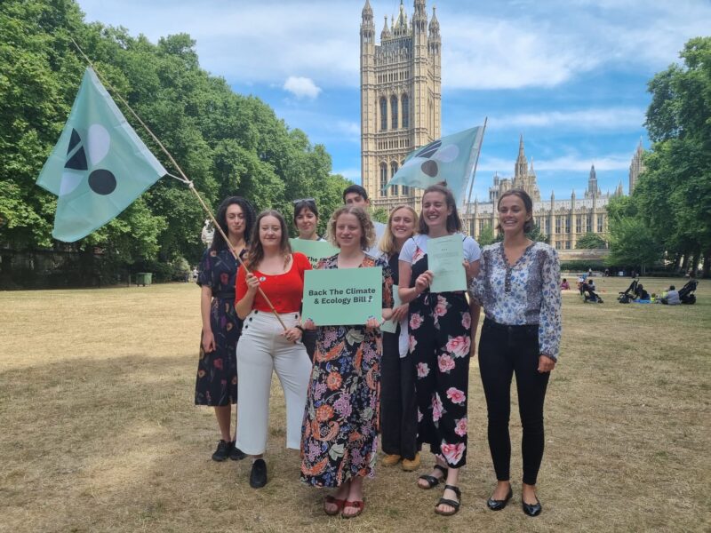 Olivia outside Parliament with campaigners